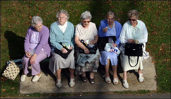 Five elderly ladies having lunch